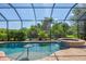 Relaxing screened-in pool and spa, surrounded by lush landscaping at 4811 Cabreo Ct, Lakewood Ranch, FL 34211