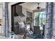 Outdoor kitchen with stainless steel grill and seating area at 4811 Cabreo Ct, Lakewood Ranch, FL 34211