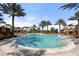Resort-style pool with lounge chairs and palm trees at 4811 Cabreo Ct, Lakewood Ranch, FL 34211