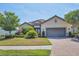 One-story home with landscaped yard at 4811 Cabreo Ct, Lakewood Ranch, FL 34211