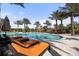 Resort-style pool with lounge chairs and palm trees at 4811 Cabreo Ct, Lakewood Ranch, FL 34211