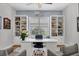 Spacious home office with built-in shelving and hardwood floors at 4811 Cabreo Ct, Lakewood Ranch, FL 34211