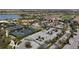 Golf course community with tennis courts, clubhouse, and lake at 4811 Cabreo Ct, Lakewood Ranch, FL 34211