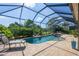 Inviting screened-in pool and spa with lounge chairs at 4811 Cabreo Ct, Lakewood Ranch, FL 34211