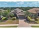Single-Gathering home with landscaped yard and paved driveway, in a tree-lined community at 4811 Cabreo Ct, Lakewood Ranch, FL 34211