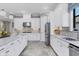 Bright kitchen with white cabinets,granite countertops and stainless steel appliances at 4811 Cabreo Ct, Lakewood Ranch, FL 34211