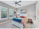 Cozy bedroom featuring a queen bed and window shutters at 4811 Cabreo Ct, Lakewood Ranch, FL 34211