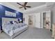 Main bedroom with ensuite bathroom and blue accent wall at 4811 Cabreo Ct, Lakewood Ranch, FL 34211