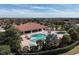 Aerial view of resort-style pool with clubhouse and lush landscaping at 4811 Cabreo Ct, Lakewood Ranch, FL 34211
