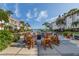 Inviting fire pit area with wooden chairs, perfect for gatherings at 220 Santa Maria St # 240, Venice, FL 34285