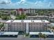 Aerial view of condo building, showcasing parking and landscaping at 220 Santa Maria St # 240, Venice, FL 34285
