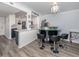 Kitchen breakfast bar with seating for three and granite countertop at 220 Santa Maria St # 240, Venice, FL 34285