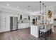 Modern kitchen featuring white cabinets and granite island at 4701 50Th W Ave, Bradenton, FL 34210