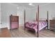 Bedroom with a post bed and wood floors at 4701 50Th W Ave, Bradenton, FL 34210