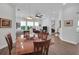 Formal dining room with wood table and chairs, open to living area at 4701 50Th W Ave, Bradenton, FL 34210