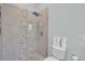 Modern bathroom with a large walk-in shower and hexagonal tile at 4701 50Th W Ave, Bradenton, FL 34210