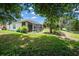 Backyard view with screened patio and lush landscaping at 4701 50Th W Ave, Bradenton, FL 34210