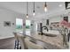 Gourmet kitchen with granite countertops and modern lighting at 4701 50Th W Ave, Bradenton, FL 34210