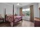 Bedroom with a post bed and wood floors at 4701 50Th W Ave, Bradenton, FL 34210