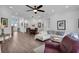 Open concept living space with hardwood floors and comfortable seating at 4701 50Th W Ave, Bradenton, FL 34210