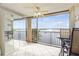 Living room with water views and balcony access at 8911 Midnight Pass Rd # 511, Sarasota, FL 34242