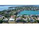 Aerial view of a waterfront home with a large backyard and circular driveway at 121 Seagull Ln, Sarasota, FL 34236