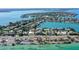 Aerial view showing a home's location near water, roads, and other houses at 121 Seagull Ln, Sarasota, FL 34236