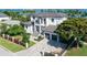 Luxury waterfront home with a large driveway and beautifully landscaped yard at 121 Seagull Ln, Sarasota, FL 34236