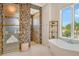 Spa-like bathroom with walk-in shower and mosaic tile at 121 Seagull Ln, Sarasota, FL 34236