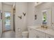 Elegant bathroom with a shower, toilet, and modern vanity at 121 Seagull Ln, Sarasota, FL 34236