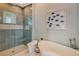 Elegant bathroom with a walk-in shower and soaking tub at 121 Seagull Ln, Sarasota, FL 34236