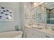 Spa-like bathroom with a soaking tub and modern vanity at 121 Seagull Ln, Sarasota, FL 34236