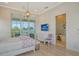 Comfortable bedroom with a view and en-suite bathroom at 121 Seagull Ln, Sarasota, FL 34236