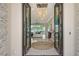 Elegant entryway with double doors and a stunning light fixture at 121 Seagull Ln, Sarasota, FL 34236