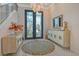 Bright and airy entryway with unique stained glass doors at 121 Seagull Ln, Sarasota, FL 34236