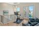 Home gym with an exercise bike and relaxing chairs at 121 Seagull Ln, Sarasota, FL 34236