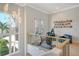 Bright home gym with an exercise bike and city view at 121 Seagull Ln, Sarasota, FL 34236