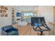 Home gym with an exercise bike and living room view at 121 Seagull Ln, Sarasota, FL 34236
