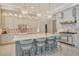 Gourmet kitchen with island, white cabinets, and high-end appliances at 121 Seagull Ln, Sarasota, FL 34236