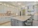 Modern kitchen with white cabinets and large island at 121 Seagull Ln, Sarasota, FL 34236