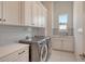 Bright laundry room with modern washer and dryer at 121 Seagull Ln, Sarasota, FL 34236