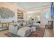 Open living space with sectional sofa and built-in wet bar at 121 Seagull Ln, Sarasota, FL 34236