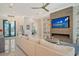 Open living area with sectional sofa, fireplace, and large TV at 121 Seagull Ln, Sarasota, FL 34236
