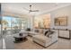 Open concept living room with water views and access to patio at 121 Seagull Ln, Sarasota, FL 34236