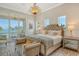 Main bedroom features a plush bed and stunning water views at 121 Seagull Ln, Sarasota, FL 34236