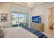 Main bedroom with sliding doors leading to the patio at 121 Seagull Ln, Sarasota, FL 34236