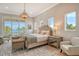 Elegant main bedroom with water views and sitting area at 121 Seagull Ln, Sarasota, FL 34236