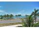 Stunning ocean view with palm trees and blue skies at 121 Seagull Ln, Sarasota, FL 34236