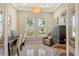 Home office with built-in workspace and plenty of natural light at 121 Seagull Ln, Sarasota, FL 34236
