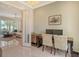 Bright office space with two computer stations and view to living room at 121 Seagull Ln, Sarasota, FL 34236